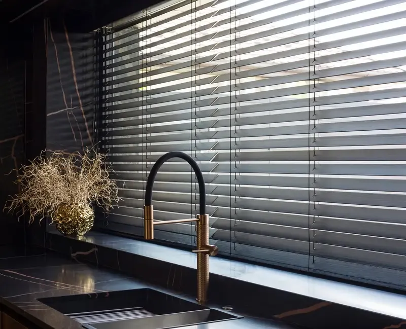 Wood & Faux wood blinds on a window from Black Pearl Blinds who sells window coverings and blinds in Vancouver.
